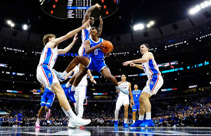 Nov 14, 2023; Chicago, Illinois, USA; Kansas Jayhawks guard Johnny Furphy (10) defends Kentucky Wildcats guard Rob Dillingham (0) during the first half at United Center. Mandatory Credit: David Banks-USA TODAY Sports